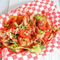 Beale St. Nachos · Fried Tortillas  are layered with Pulled Pork, queso cheese, green onions,  hot sweet pepper...