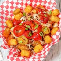 Loaded Bbq Tots · Our tater tots are loaded with pulled pork, melted queso cheese, hot sweet peppers, green on...
