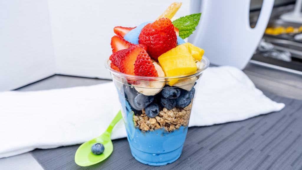 “Blue Magic” · Blue Spirulina Yogurt, Blueberries, Chia Seeds, Hemp Seeds, Bananas Granola, Pineapple, Strawberries, Mint, Crystalized Ginger, Agave.