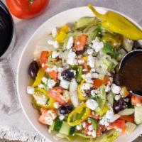 Greek Salad · Lettuce, tomato, cucumber, mushrooms, onions, bell peppers, banana peppers, and black olives.