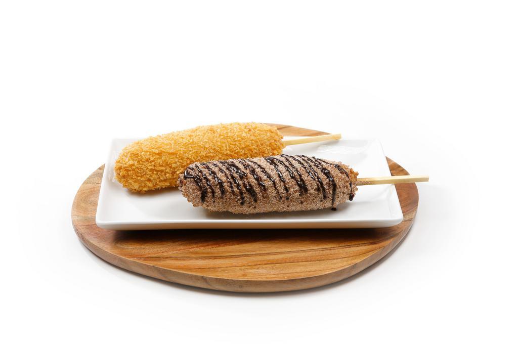 Churros · ROLLED IN CINNAMON SUGAR AND DRIZZLED IN CHOCOLATE SAUCE