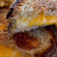 Artisan Grilled Cheese · Aged cheddar, provolone, French fries, zaks bread.