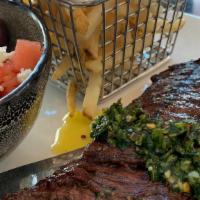 Churrasco Skirt Steak Chimichurri · Watermelon, tomato, feta, olives, parley and french fries.