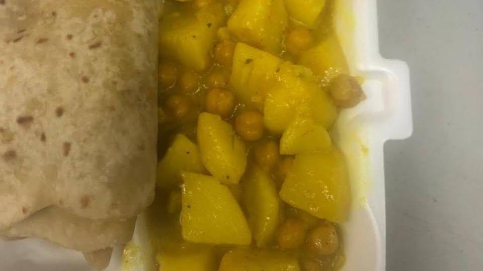 Curry Potatoes And Curry Chick Peas · Served with rice and peas or white rice cabbage and carrots and plantain.