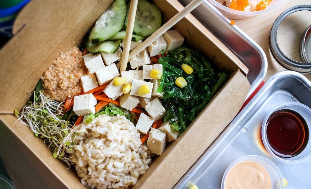 Yin Yang · Tofu, lettuce, green onion, cilantro, seaweed salad, cucumber salad, with sesame oil and sesame ginger. Vegan.