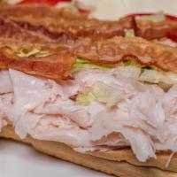 Turkey Club · Oven Roasted Turkey Breast with Applewood Smoked Bacon Recommended with: Lettuce, Tomato, On...