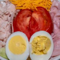 Chef Salad · Ham, turkey, cheese, boiled egg, lettuce, tomatoes, and onions.