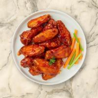 Buffalo Favorite Wings · Fresh chicken wings breaded, fried until golden brown, and tossed in buffalo sauce. Served w...
