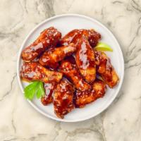 Bbq Busters Wings · Fresh chicken wings breaded, fried until golden brown, and tossed in barbecue sauce. Served ...