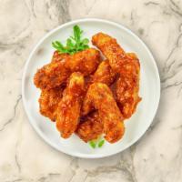 Bbq Busters Tenders · Chicken tenders breaded and fried until golden brown before being tossed in barbecue sauce.