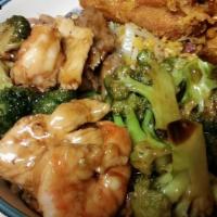 Triple Delight · Fresh jumbo shrimp, chicken & beef sauteed w. Chinese veg. In brown sauce.