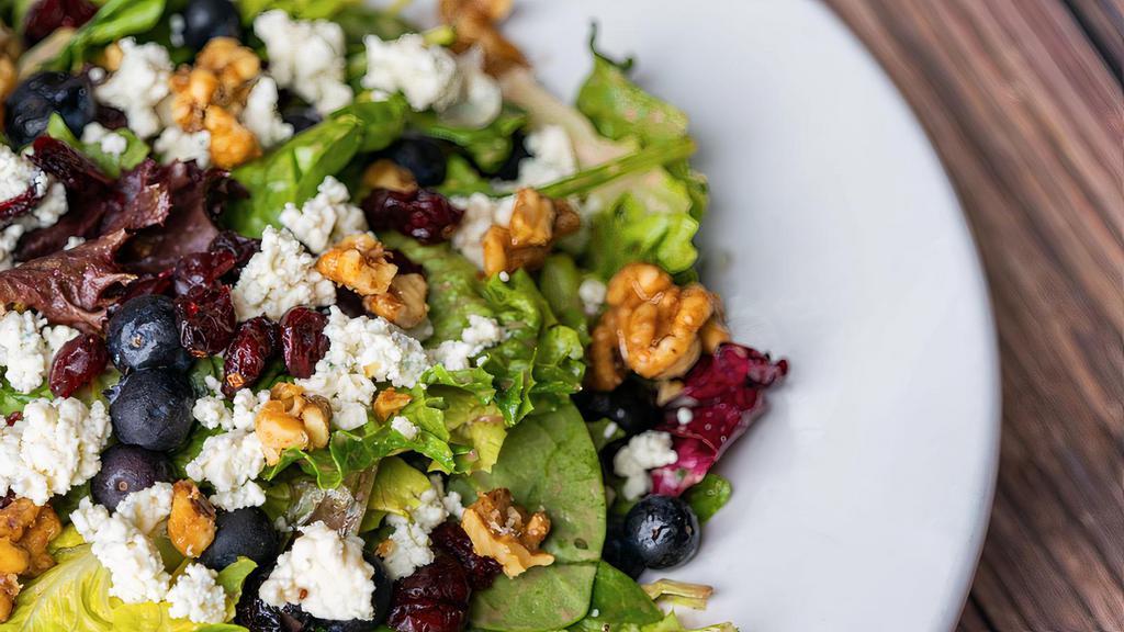 Shrimp Berries & Gorgonzola Salad · Mixed Greens, Tossed in a Strawberry Vinaigrette with Grilled Shrimp, Dried Cranberries, Fresh Blueberries and Strawberries, Candied Walnuts, and Gorgonzola Cheese