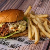 Pulled Pork Sandwich · Pulled pork, marinated and slow roasted, smothered in our bourbon bbq sauce, topped with our...