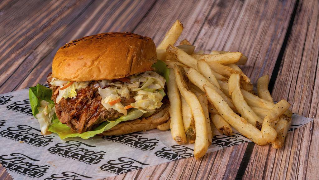 Pulled Pork Sandwich · Pulled pork, marinated and slow roasted, smothered in our bourbon bbq sauce, topped with our homemade coleslaw on a brioche bun, served with ford's signature  fries.