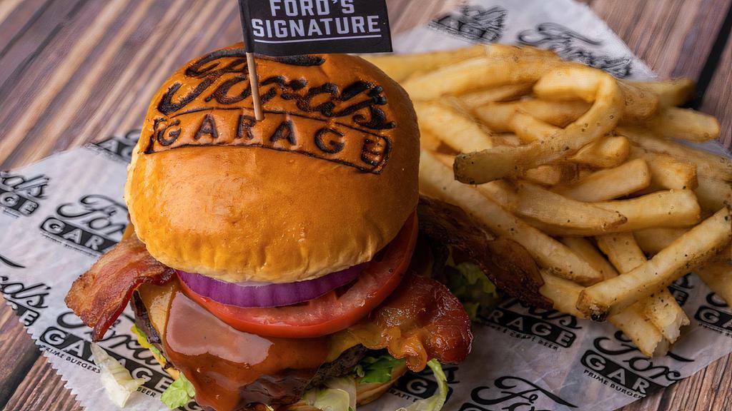 The Ford'S Signature Burger · Tillamook® Aged Sharp Cheddar Cheese, Applewood Smoked Bacon, Bourbon BBQ Sauce, Chopped Romaine, Tomato,
and Red Onion on a Brioche Bun