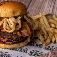 The Bbq Brisket Burger · Half pound of grilled black angus, bourbon bbq sauce, hickory smoked brisket, applewood smok...