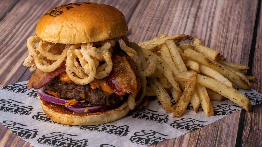 The Bbq Brisket Burger · Half pound of grilled black angus, bourbon bbq sauce, hickory smoked brisket, applewood smoked bacon, red onions, shredded cheddar cheese, and crispy onion straws.