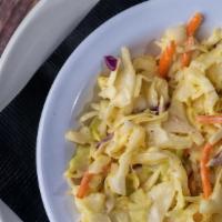 Homemade Coleslaw · Our house blend of finely-shredded cabbage, carrots, and our celery seed dressing.