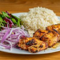 Chicken Kebab · Marinated chicken breast. Served with rice, vegetables and mixed green salad.