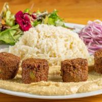 Falafel Lunch · Wrapped with lavash, lettuce, tomato, onion and humus. Served with your choice of fries, sal...