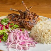 Lamb Chops · Grilled lamb chops, served with green pepper, tomato, rice or French fries.