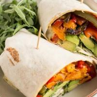 Spicy Sweet Potato Wrap · This is a sweet potato wrap topped with roasted onions, peppers, pickle relish and a spicy s...
