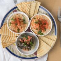 Veggie Trio Platter · Vegetarian. Pick 3 items. Hummus, baba, side salad, grape leaves, falafel, lentil soup.
