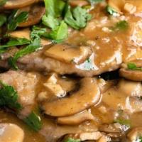 Veal Marsala · Veal cooked with mushrooms and a marsala wine sauce.