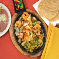 Del Mar Fajitas · Grilled shrimp, scallops, crab meat, tilapia, onions, tomatoes and bell peppers.