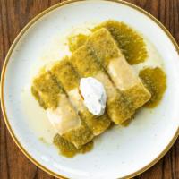 Suizas Enchiladas · Four corn enchiladas filled with grilled chicken or Angus steak, topped with green salsa, qu...