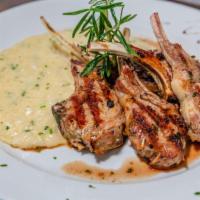 Lamb Chop Alla Griglia · New Zealand Lamb chops grilled to perfection, with a side of parmesan risotto.