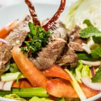 Beef Salad · A combination of sliced steak, tomato, cucumber, onion, and scallions mixed in lime juice dr...