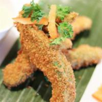 Fried Avocado · Avocado slices covered with panko bread crumb and served with spicy creamy dressing.