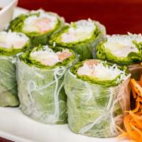 Fresh Basil Rolls · A combination of roasted pork, shrimp, cucumber, cilantro, basil leaves, and green leaves wr...