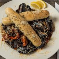 Mully Mussels · Tender mussels in a tomato wine sauce. Even better with pasta..add an extra charge