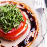 Tomate Fresco · Homemade mozzarella, tomato and basil, drizzled with balsamic vinegar reduction.