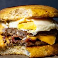 Fried Egg, Cheese & Sausage Sandwich W.  Cheesy Hash Browns · Cheese also come on the hash browns.