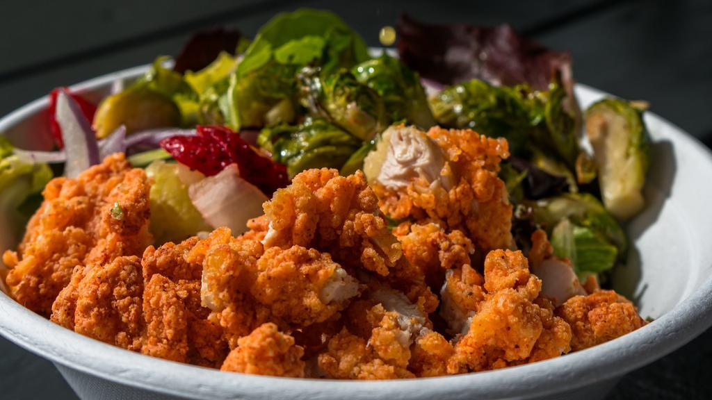 Fried Chicken Salad  · Juicy Chicken  on top of a bed of lettuce, tomatoes, onions, cheese, cucumbers and your choice of dressing. Ranch, Blue Cheese or Balsamic Vinegar. 
Comes with garlic bread.