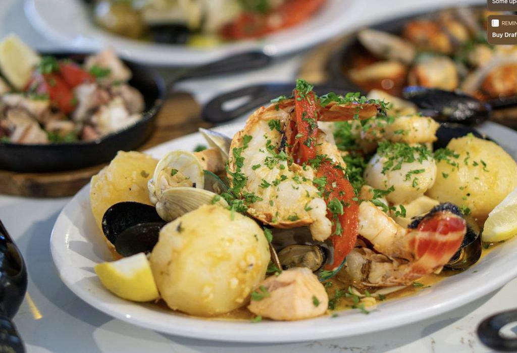 Parrilhada De Mariscos For 2 · Grilled Seafood Mix in White Wine and Garlic Sauce with Lobster, Scallops, Shrimp, Clams, Mussels, Squid, Fish, Salmon and steamed Potatoes
