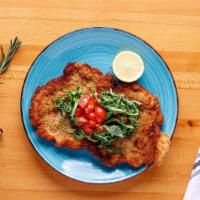 Chicken Milanese · Organic chicken breaded and baked in the oven, served
with arugula and cherry tomatoes.