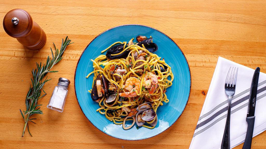 Seafood Spaghetti · Octopus, calamari, squid, shrimp, mussels and
clams.