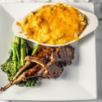 Char Grilled Garlic Cilantro Lamb Chops · Our USDA certified lamb chops are char-grilled and served with asparagus and rice.