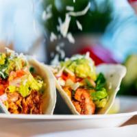 Original Two Taco · Two original tacos with lettuce, pico de gallo, guacamole, and cheese. Served with chips and...