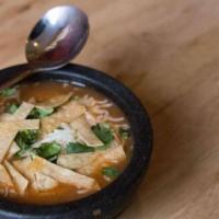 Tortilla Soup · Tortilla soup, topped with cheese, fresh cilantro, and crispy tortilla strips. 
DO NOT ADD E...