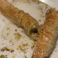 Lady Fingers · Layers of phyllo dough rolled & scrunched stuffed with crushed pistachios. Baked & topped wi...