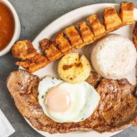 Bandeja Paisa · Colombian platter combines red beans, white rice, grilled steak, pork crackling, sweet plant...
