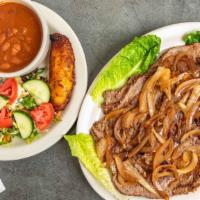 Carne Encebollada · Grilled steak topped with grilled onions. Served with red beans, white rice, salad, and swee...