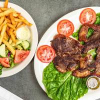 Punta De Anca (Picanha) · Grilled steak picanha (12 oz). Served with white rice, salad, and French fries or sweet plan...