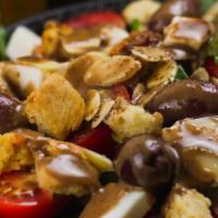 Cherry Tomato Salad · mixed greens, cherry tomatoes, fresh mozzarella, almonds, homemade croutons, black olives, I...