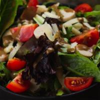 Capricciosa Salad · mixed greens, hearts of palm, tomatoes, parmesan shaves, Italian dressing